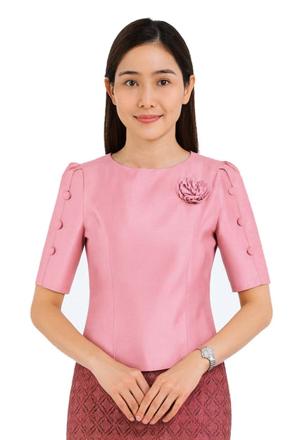 Ladies authentic Thai silk blouse for women with elegant half sleeves, round neckline, decorative fabric-covered buttons, floral brooch detail and a tailored fitted silhouette. Paired with a traditional Thai patterned sarong skirt, this classic Thai formal outfit is perfect for weddings, temple visits, cultural ceremonies, festivals, receptions and special occasions. Amazon Etsy eBay Siam Regal