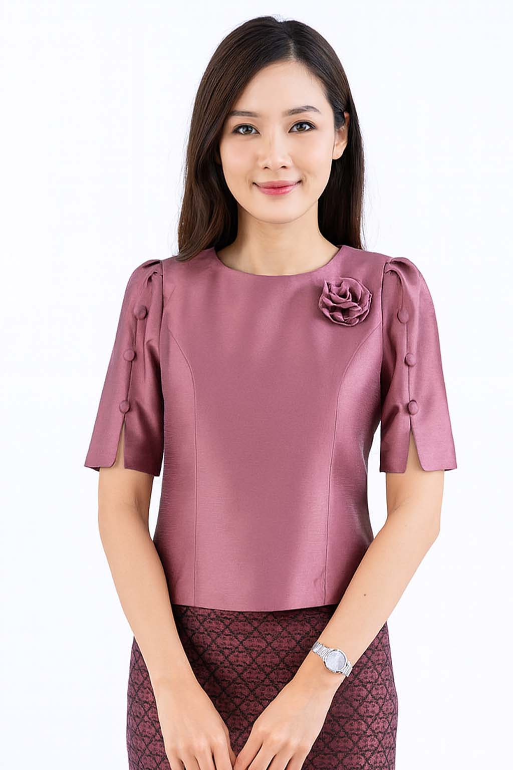 Ladies authentic Thai silk blouse for women with elegant half sleeves, round neckline, decorative fabric-covered buttons, floral brooch detail and a tailored fitted silhouette. Paired with a traditional Thai patterned sarong skirt, this classic Thai formal outfit is perfect for weddings, temple visits, cultural ceremonies, festivals, receptions and special occasions. Amazon Etsy eBay Siam Regal