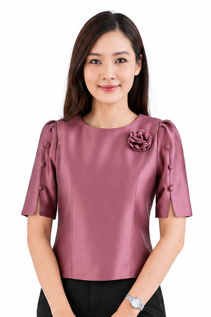 Ladies authentic Thai silk blouse for women with elegant half sleeves, round neckline, decorative fabric-covered buttons, floral brooch detail and a tailored fitted silhouette. Paired with a traditional Thai patterned sarong skirt, this classic Thai formal outfit is perfect for weddings, temple visits, cultural ceremonies, festivals, receptions and special occasions. Amazon Etsy eBay Siam Regal