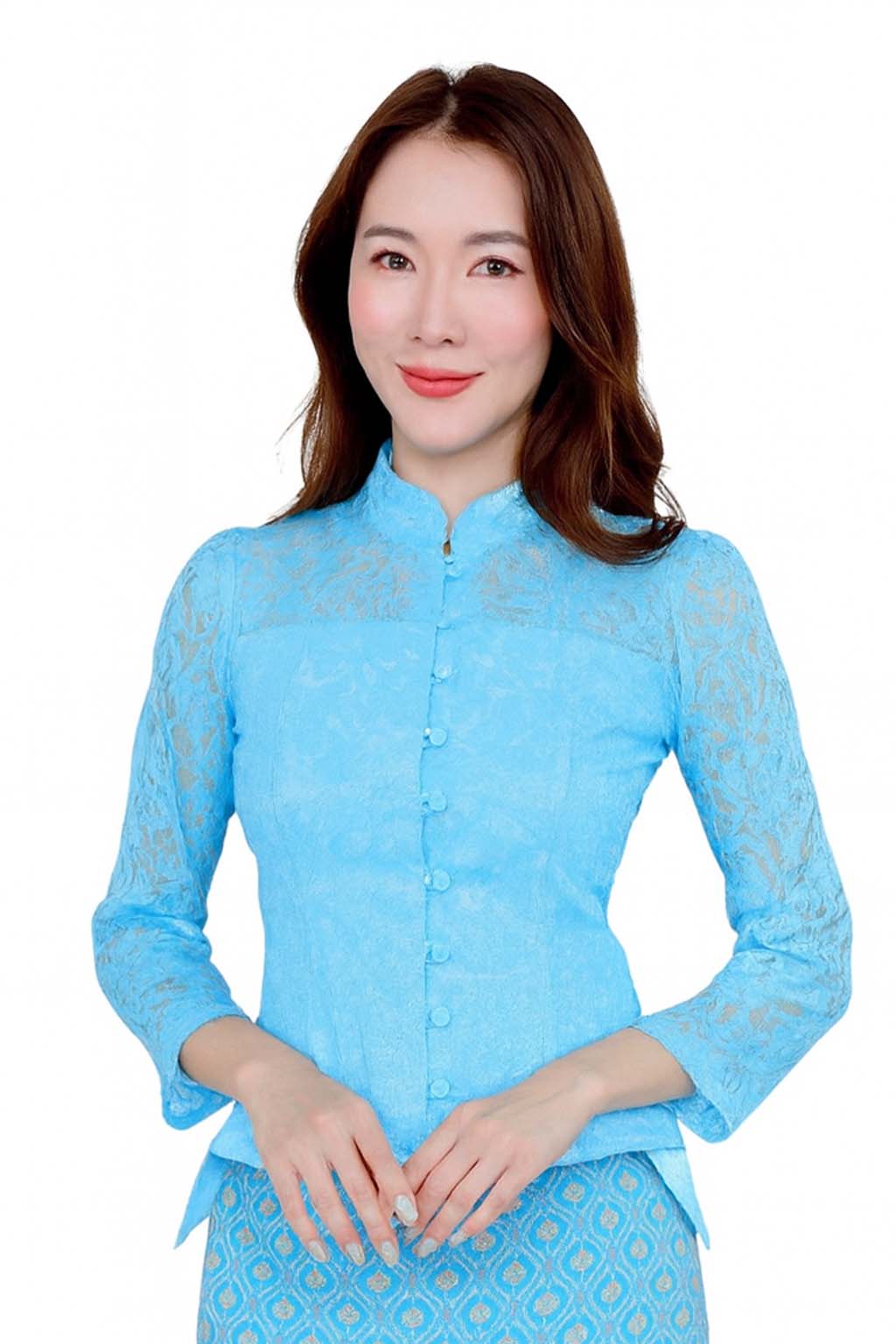 Ladies authentic Thai lace blouse for women featuring elegant floral lace, long sleeves, Mandarin collar, traditional fabric-covered buttons and a tailored fitted silhouette. Paired with a traditional Thai patterned sarong skirt, this classic Thai formal outfit is perfect for weddings, temple visits, cultural ceremonies, festivals, receptions and special occasions. Amazon Etsy eBay Siam Regal