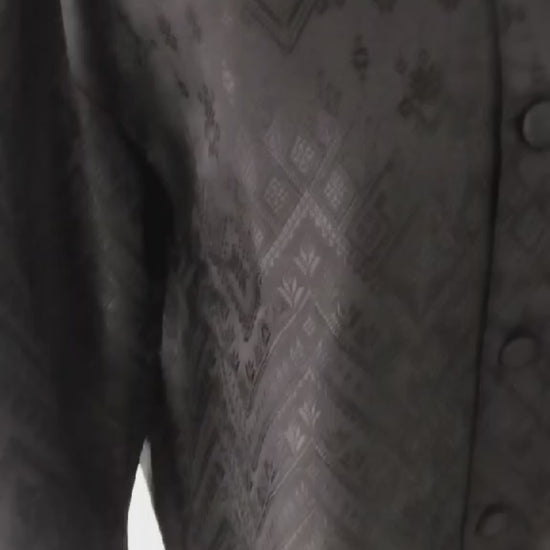 Men's black traditional Thai formal jacket with Mandarin collar, textured pattern and long sleeves, ideal for Thai weddings and cultural ceremonies.