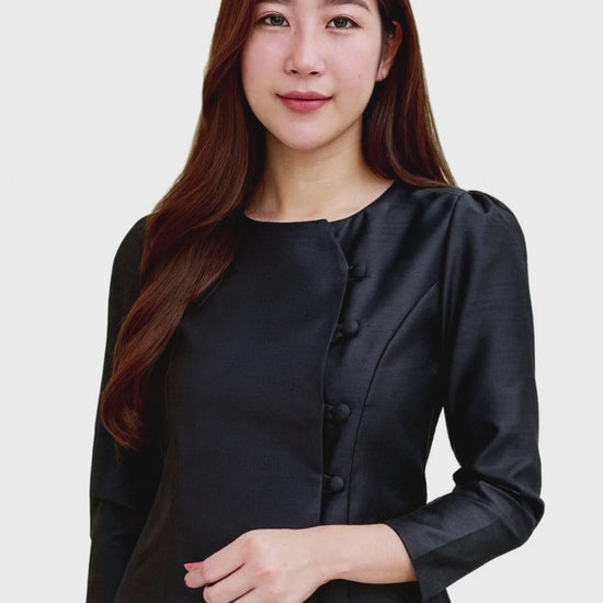 Woman wearing an authentic Thai silk blouse with a fitted tailored design, elegant long sleeves, and traditional fabric button detailing, paired with a gold patterned Thai silk sarong skirt. Classic Thai formal attire ideal for weddings, temple ceremonies, cultural festivals, traditional performances, formal events, and celebrations. Premium Thai silk craftsmanship photographed on a pure white background to showcase the garment's true color and design