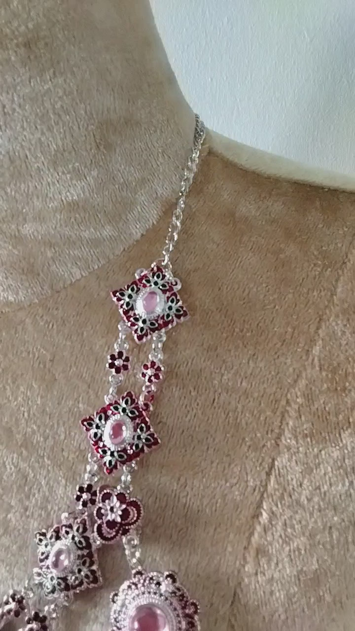 Authentic Thai wedding jewelry set in silver featuring an ornate statement necklace, matching earrings, engraved waist belt and traditional shoulder chain with pink gemstone accents. Inspired by classic Thai royal bridal jewelry, this luxury Thai accessory set is perfect for Thai weddings, cultural ceremonies, traditional dance, festivals, pageants and formal occasions. Amazon Etsy eBay Siam Regal